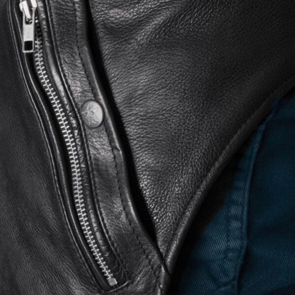 Close-up view of black leather chaps featuring a durable YKK zipper and sleek stitching.